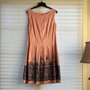 Sleeveless taffeta fully lined light peach dress with black beaded detail